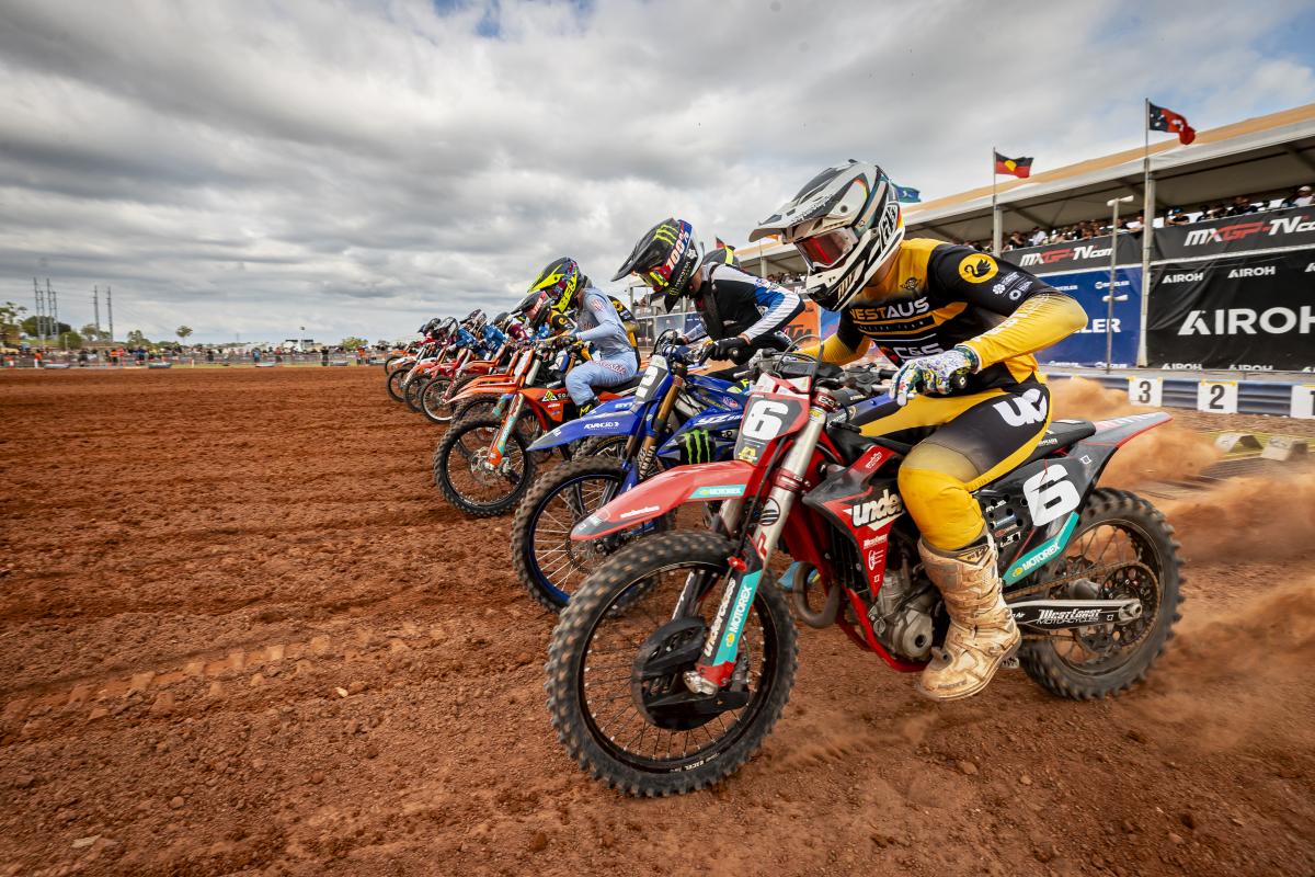 Motorcross competitors line up as the race begins