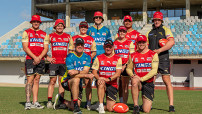 Players from the NRL Dolphins team