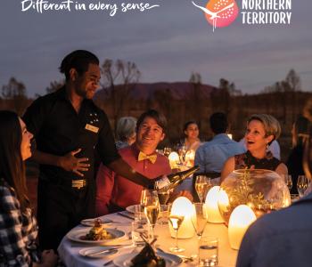 image of outdoor diners being served by waiter in Uluru