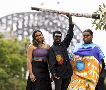 image of three Aboriginal musicians under harbour bridge