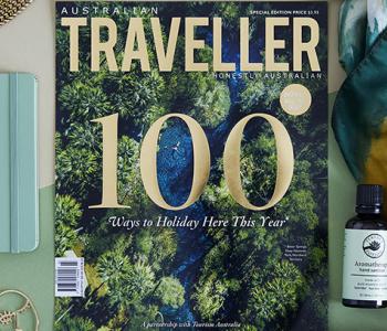 flat lay showing front cover of Australian Traveller magazine with top 100 trips