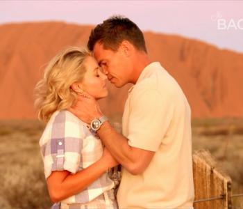 image of couple in front of Uluru