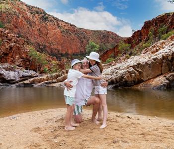 image of grandad hugging kids at Ormiston Gorge