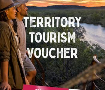 image of man and woman looking over escarpment and gorge with font on top