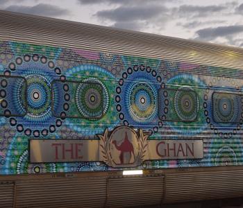 Image of The Ghan train with Aboriginal artwork dot painting