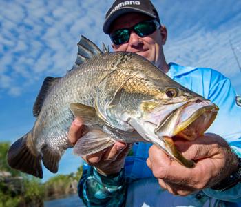 Fisherman holding fish