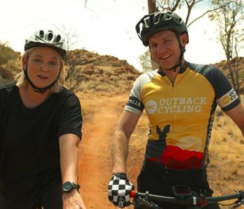 Two people riding bikes in the NT