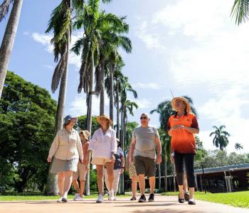 Visitors with a tour guide on a walking tour at the George Brown Botanic Gardens