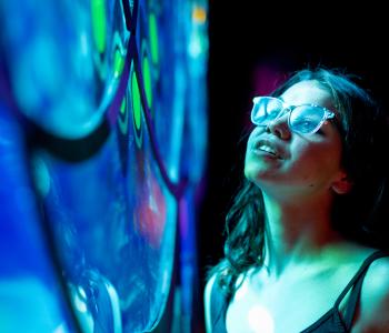 A visitor enjoys the Merging Kultcha installation