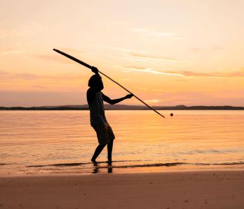 Aboriginal Tourism - Silhouette man fishing beach