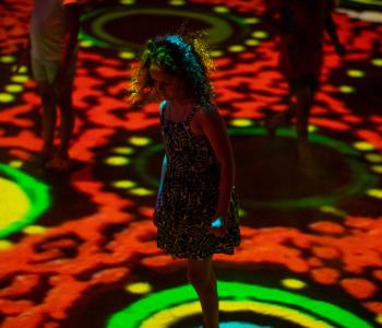 Children play at Grounded, Parrtjima. Grounded artwork Wild Flowers by Camilla Hayes