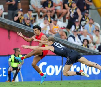 Gold Coast Suns player Malcolm Rosas kicking a goal