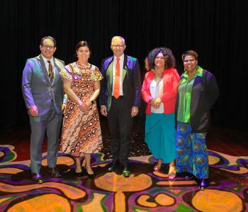 Member for Solomon Luke Gosling, NT Chief Minister Natasha Fyles, Prime Minister Anthony Albanese, Senator for the NT Malarndirri McCarthy and Member for Lingiari Marion Scrymgour at Facing North, Parliament House standing on Parrtjima installation Grounded.