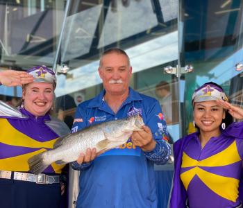 Tony McLean poses with two Captain Starlights and his winning barra