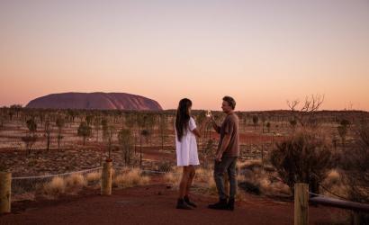 Couple watching sunset at Uluru