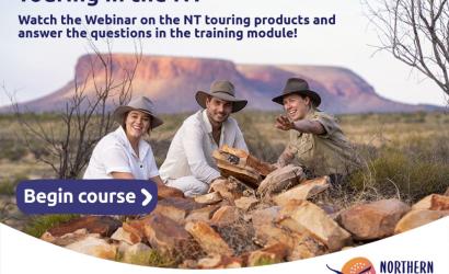 Tourists with guide in front of some mountain ranges