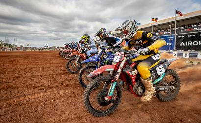 Motorcross competitors line up as the race begins
